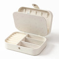 Portable multi-compartment jewelry box with velvet lining - travel-friendly pink accessory storage box